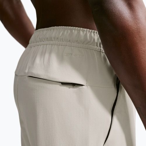 Men's trousers Nike Unlimited ight orewood brown/black/light orewood brown