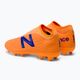 Children's football boots New Balance Tekela V3+ Magique FG orange JST3FD35.M.045 3