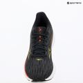 Women's running shoes Mizuno Wave Rider 28 black/evening primrose/poppy red 9