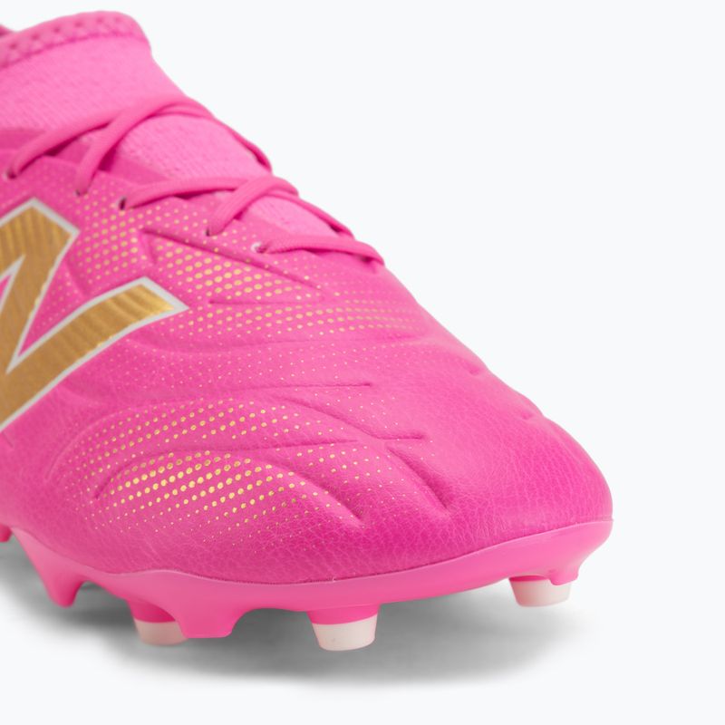 Children's football boots New Balance Tekela Team V5 pink heat/metallic gold/pink satin 7