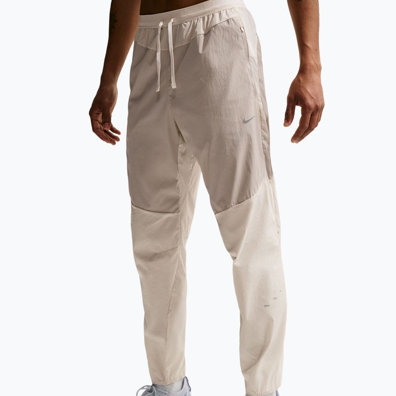 Men's running trousers Nike Stride Repel Woven cream li/birch/natural 4