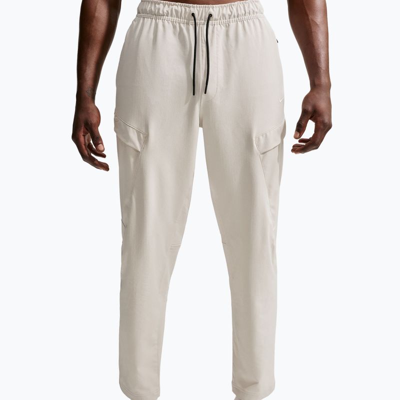 Men's trousers Nike Unlimited ight orewood brown/black/light orewood brown